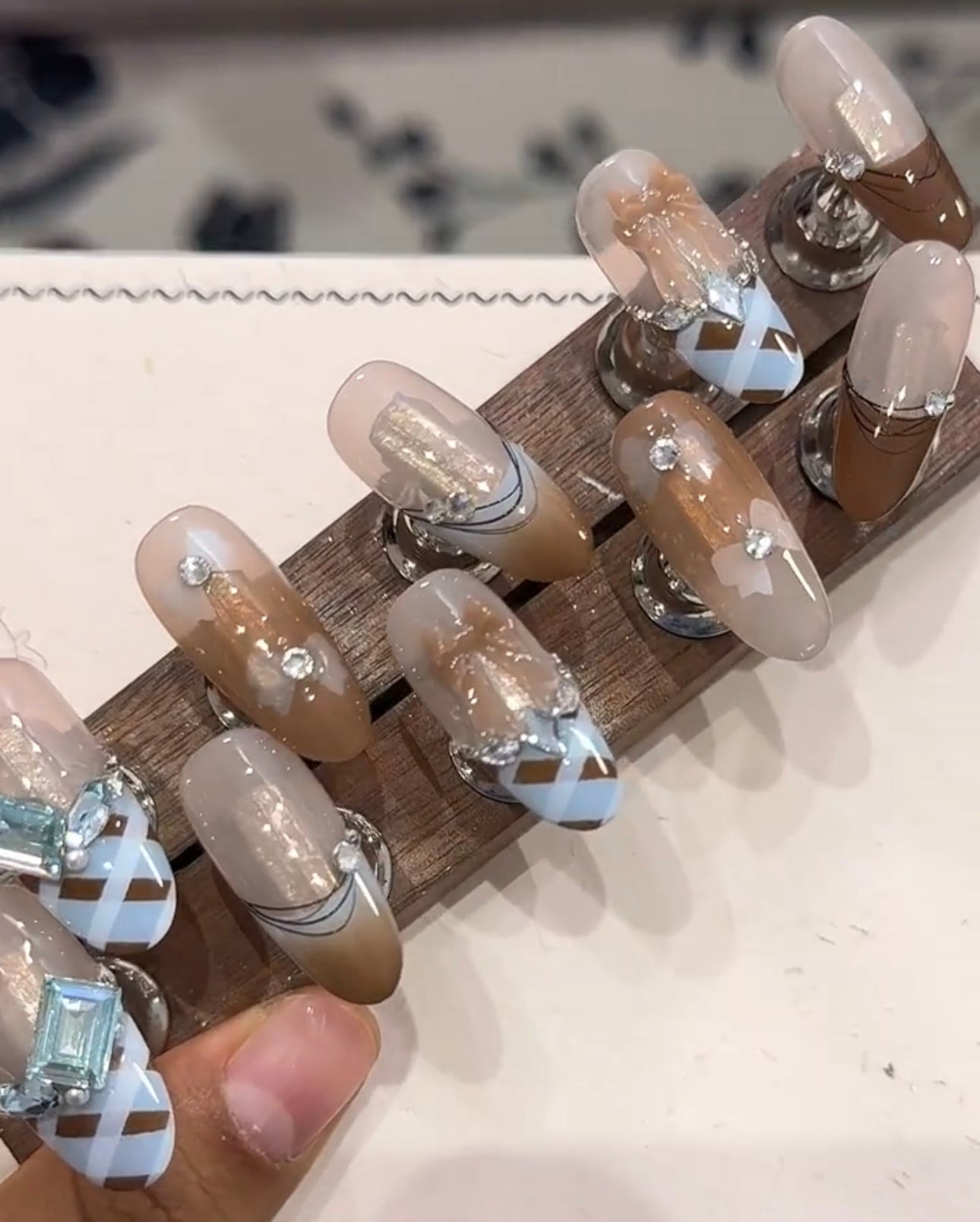 Blue and brown bow diamond nails