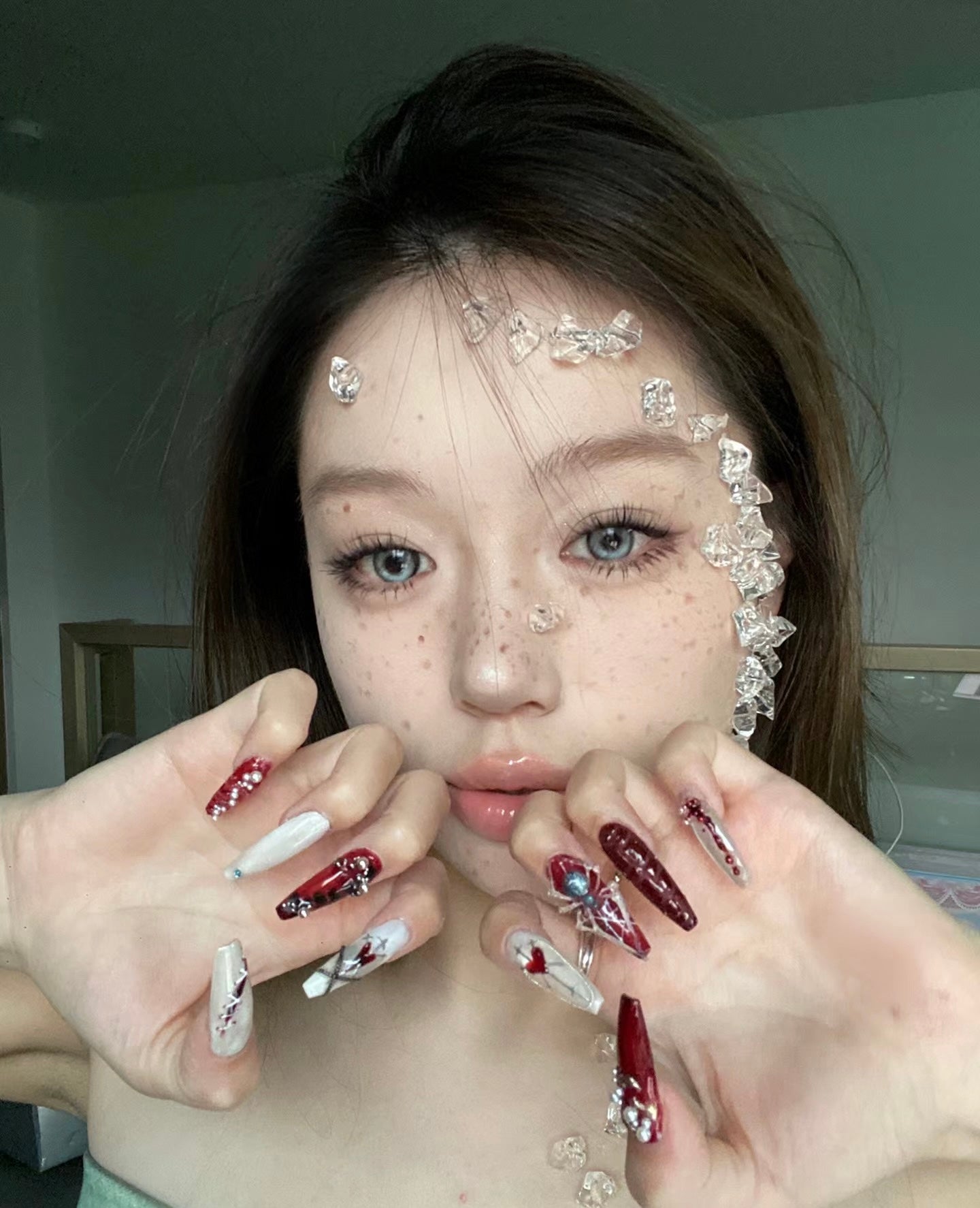"Gothic Elegance: Dark Red and White Nail Art with 3D Embellishments"