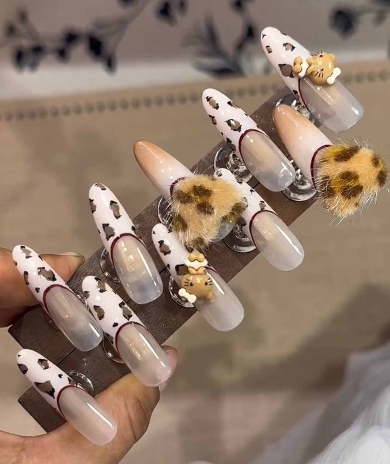 Sweet brown leopard print hello Kitty nails