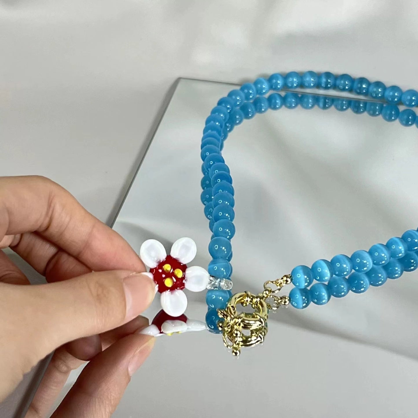 Craftworks cat's eye stone resort style handmade glass colorful flower necklace