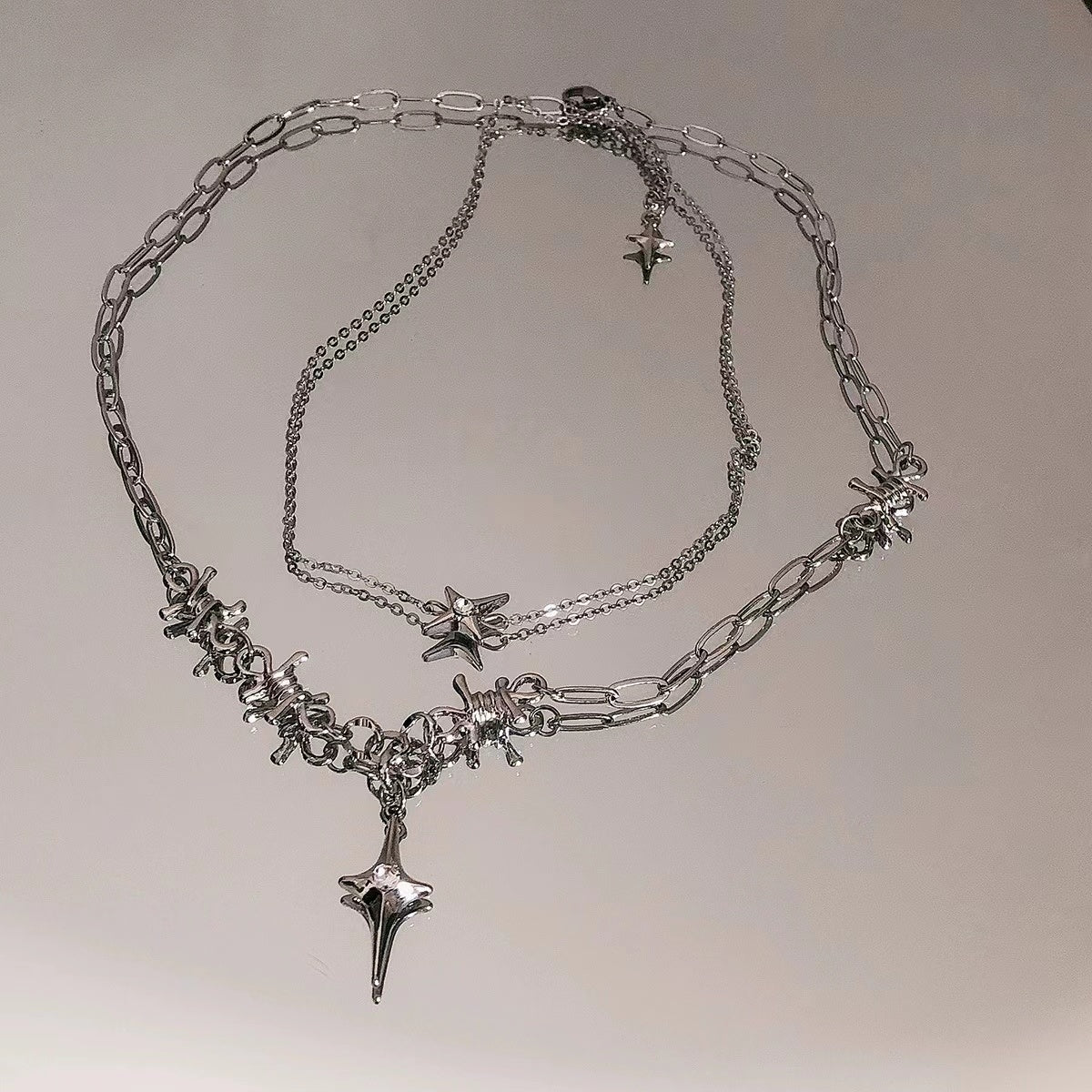 Double stacked wearing four mangoes stitching necklace female 2022 new niche design cold wind cross collarbone chain
