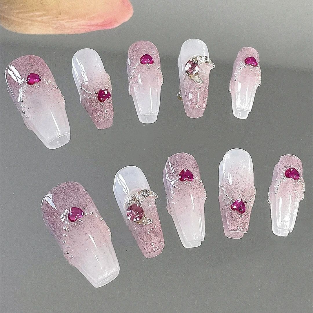 Handmade custom nails with small diamonds and cute hearts