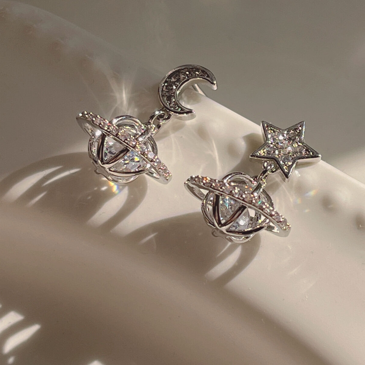 Asymmetrical sparkling stars and moons, three-dimensional micro-set zircon, exquisite and simple 925 silver earrings, female