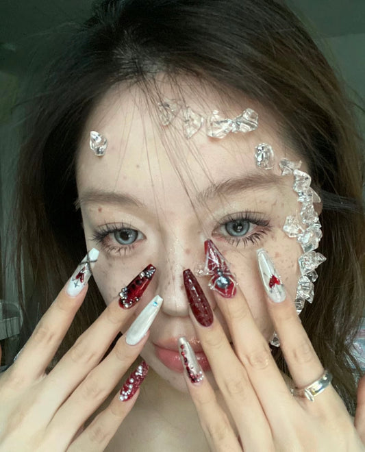 "Gothic Elegance: Dark Red and White Nail Art with 3D Embellishments"