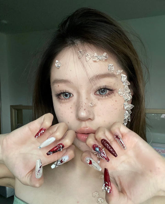 "Gothic Elegance: Dark Red and White Nail Art with 3D Embellishments"