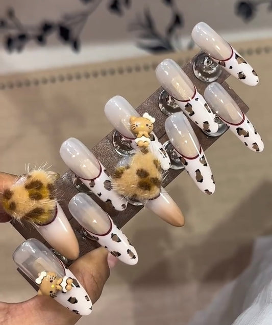 Sweet brown leopard print hello Kitty nails