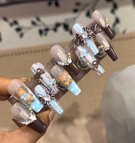 Brown bow melancholy bear nails