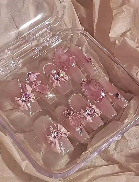 Pink Swarovski crystal Barbie nails.