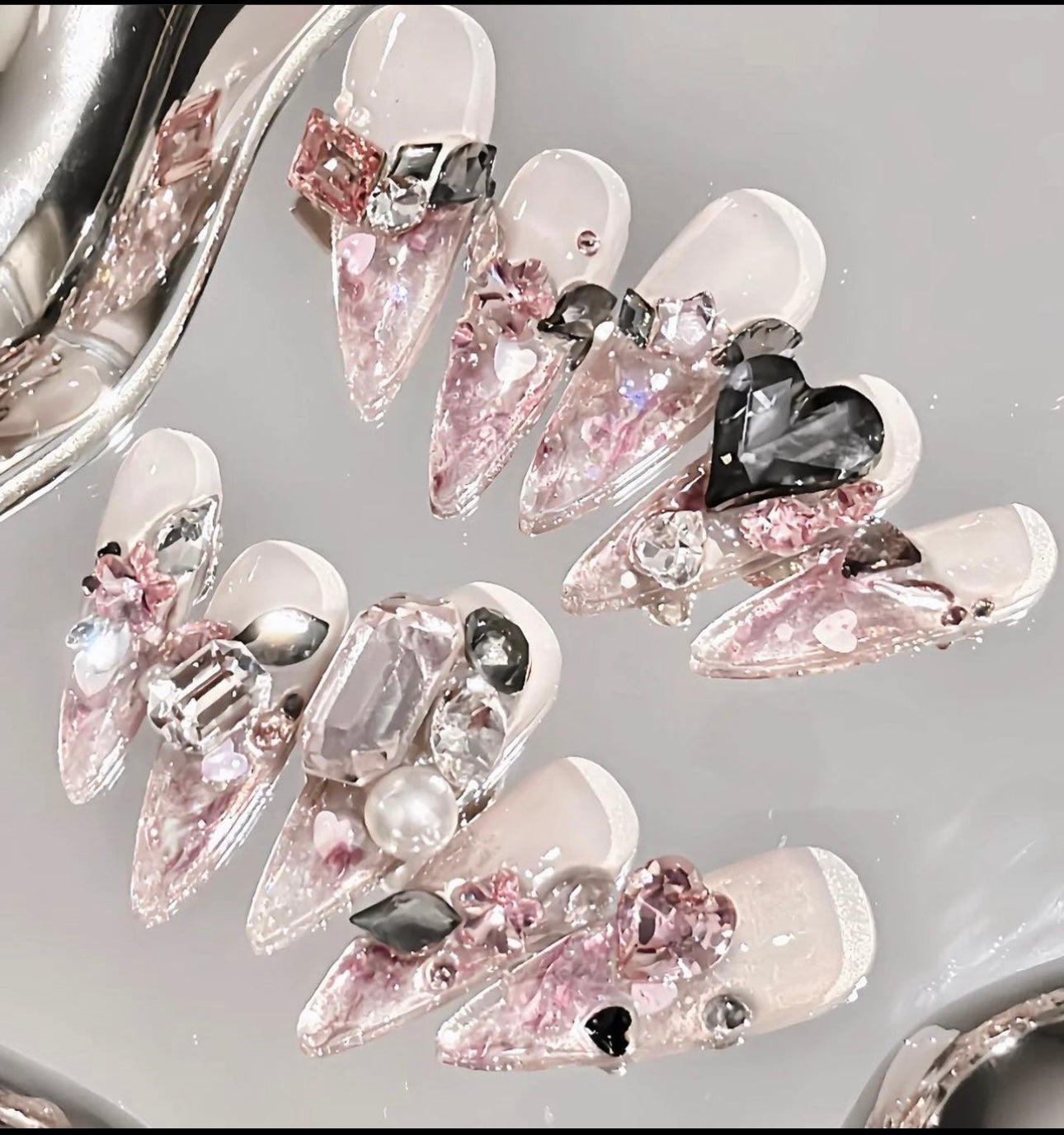 Pink Swarovski crystal nails.