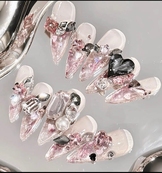 Pink Swarovski crystal nails.