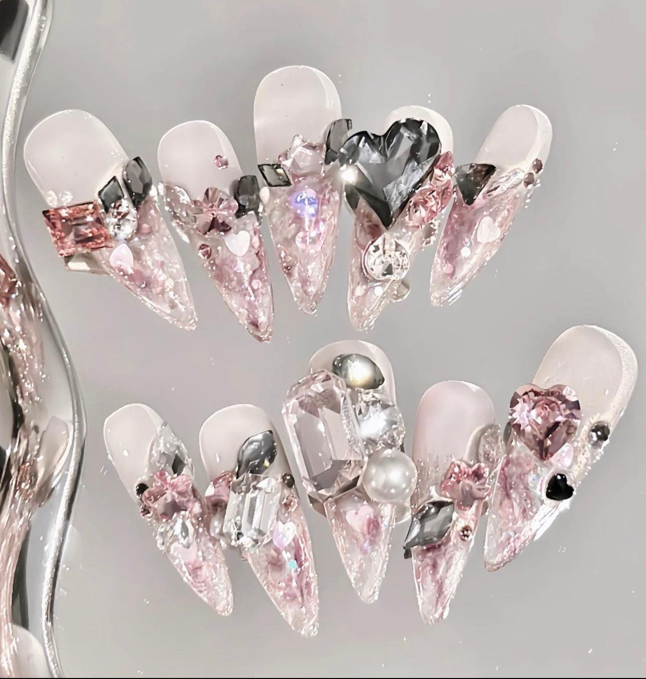 Pink Swarovski crystal nails.