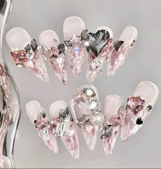 Pink Swarovski crystal nails.