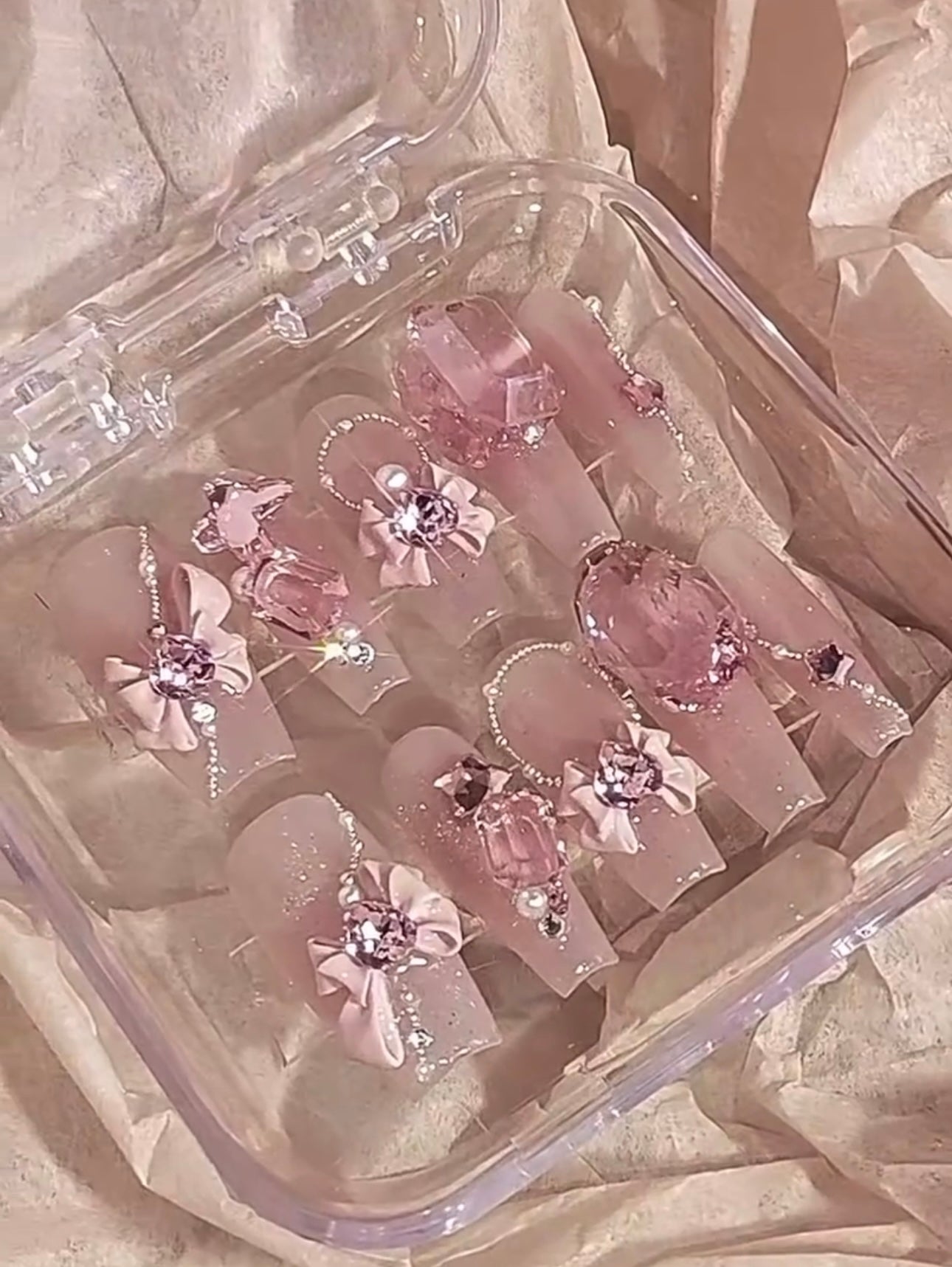 Pink Swarovski crystal Barbie nails.