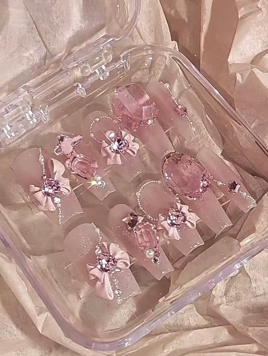 Pink Swarovski crystal Barbie nails.