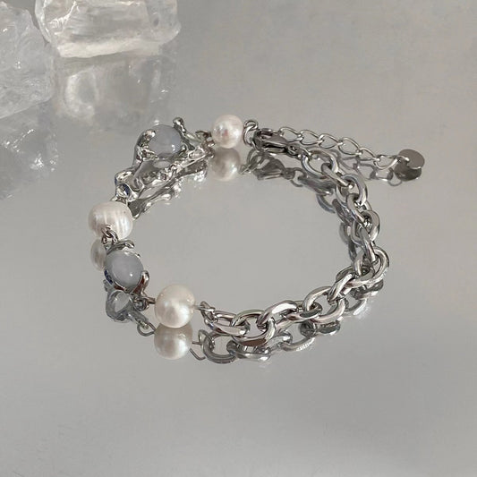 Fashion versatile moonstone stitching pearl bracelet female light luxury ins niche design senior sense of personality hand jewelry tide