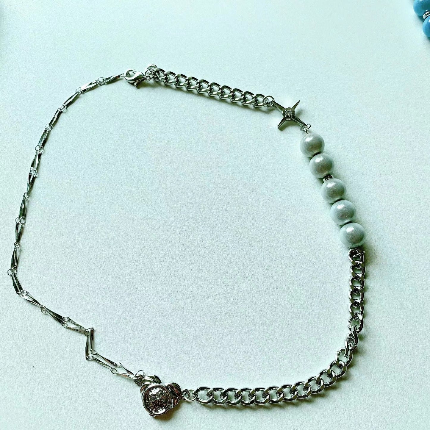 Reflective blue and white pearl cross patchwork necklace