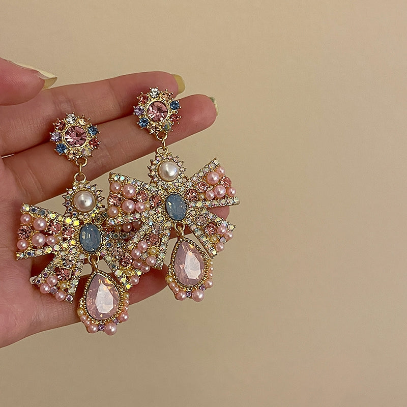 Pink exaggerated pearl bow earrings, unique design sense, light luxury earrings, evening dress earrings, female