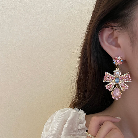 Pink exaggerated pearl bow earrings, unique design sense, light luxury earrings, evening dress earrings, female